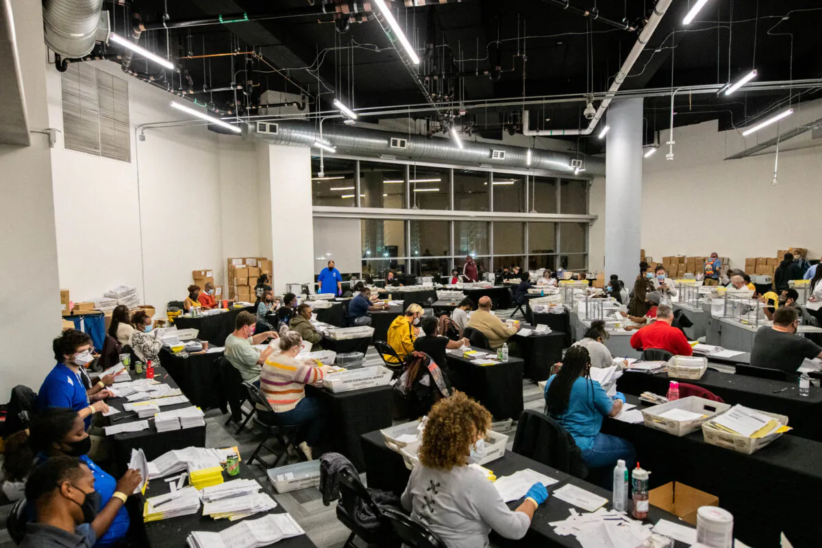 Employees of the Fulton County Board of Registration and Elections process ballots in Atlanta, Ga., on Nov. 4, 2020. (Brandon Bell/Reuters)