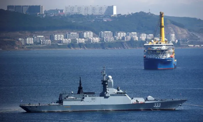The Russian navy corvette Sovershenny and the Gazprom owned pipe-laying ship Akademik Cherskiy are seen offshore Vladivostok, Russia, on Sept. 6, 2017. (Sergei Karpukhin/Reuters)