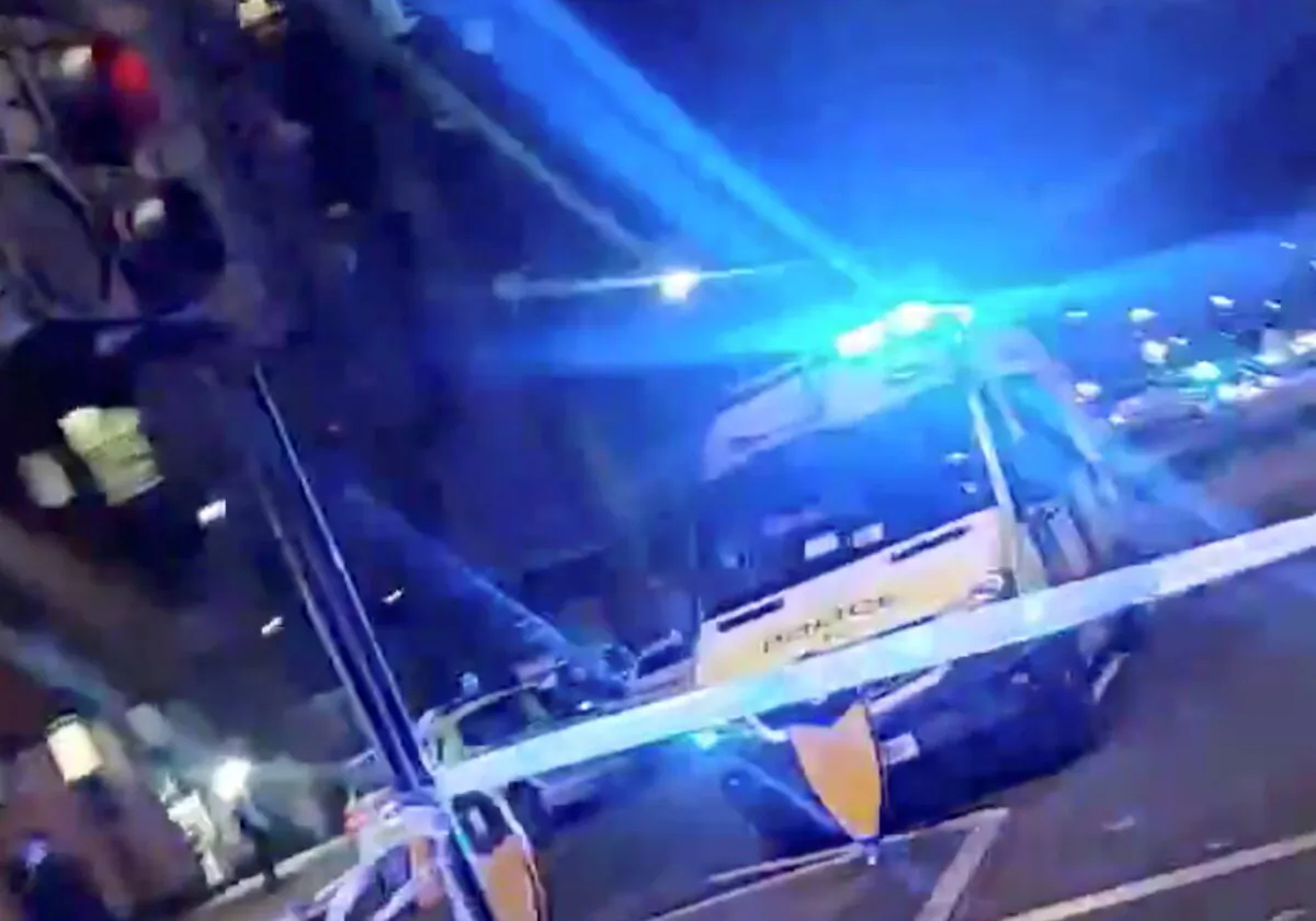 A police car is seen after an incident at Edmonton Police station in London, Britain November 11, 2020, (Credit: this still image obtained from a social media video. Twitter @chechiok/via REUTERS)
