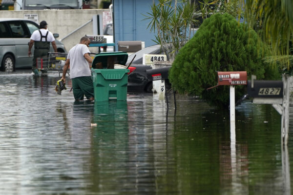Residents clear debris