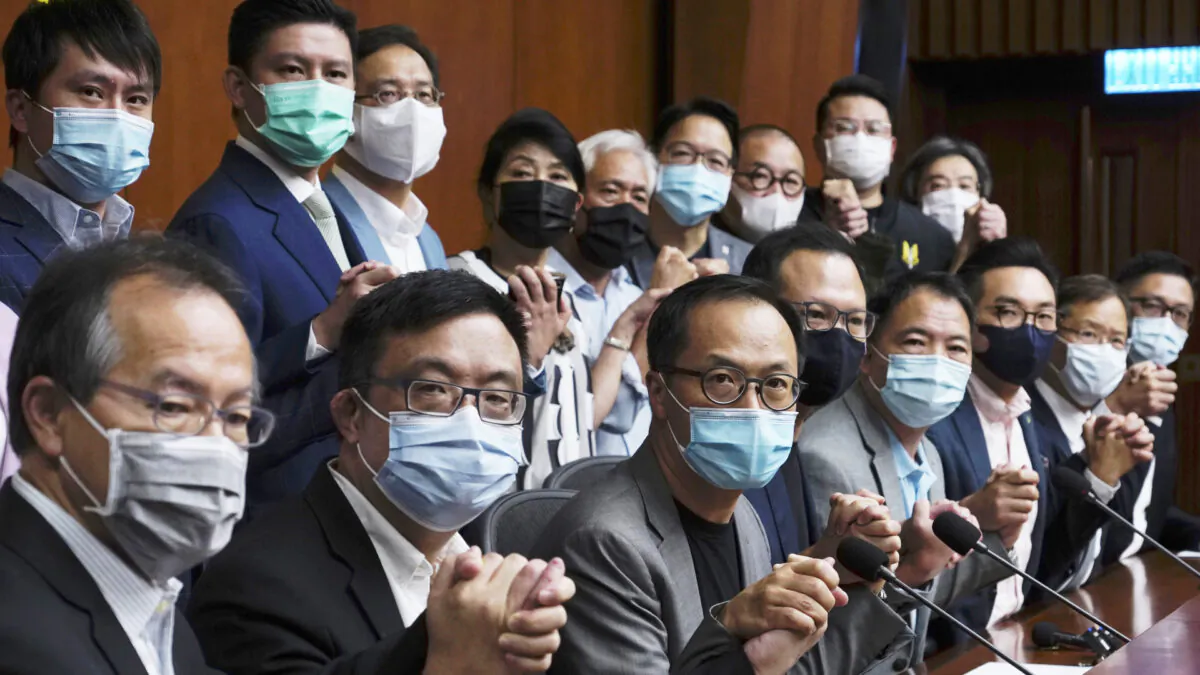 Hong Kong's pro-democracy legislators pose a picture before a press conference at the Legislative Council in Hong Kong on Nov. 9, 2020. (Vincent Yu/AP Photo)