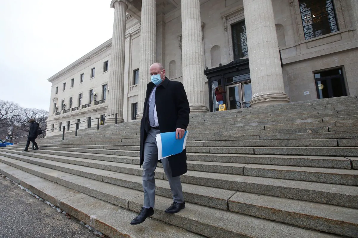 Dr. Brent Roussin, Manitoba chief public health officer, leaves after speaking at the province's latest COVID-19 update at the Manitoba legislature in Winnipeg on Oct. 30, 2020. (The Canadian Press/John Woods)
