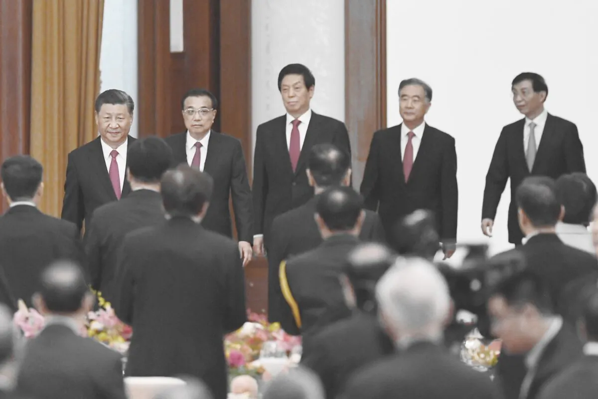 Chinese leader Xi Jinping (L), Premier Li Keqiang (2nd L), and Politburo Standing Committee members (L-R) Li Zhanshu, Wang Yang, and Wang Huning arrive for a reception at the Great Hall of the People in Beijing on Sept. 30, 2020. (GREG BAKER/AFP via Getty Images)