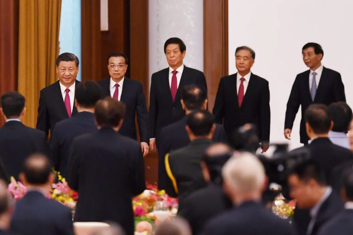 Chinese leader Xi Jinping (L), Premier Li Keqiang (2nd L), and Politburo Standing Committee members (L-R) Li Zhanshu, Wang Yang, and Wang Huning arrive for a reception at the Great Hall of the People in Beijing, China, on Sept. 30, 2020. (Greg Baker/AFP via Getty Images)