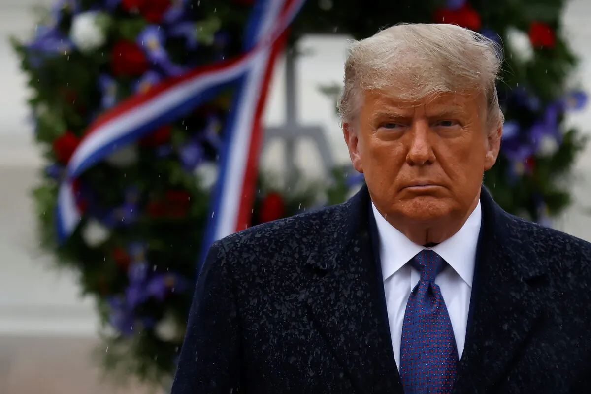 President Donald Trump turns after placing a wreath at the Tomb of the Unknown Soldier as he attends a Veterans Day observance in the rain at Arlington National Cemetery in Arlington, Virginia on Nov. 11, 2020. (Carlos Barria/Reuters)