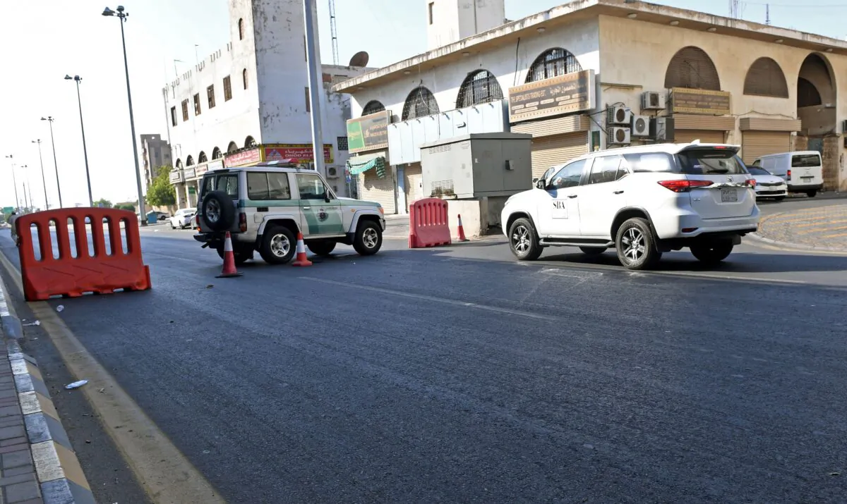 Saudi police close a street leading to a non-Muslim cemetery in Jeddah, where a bomb struck a World War I commemoration attended by European diplomats, on Nov. 11, 2020. (AFP via Getty Images)