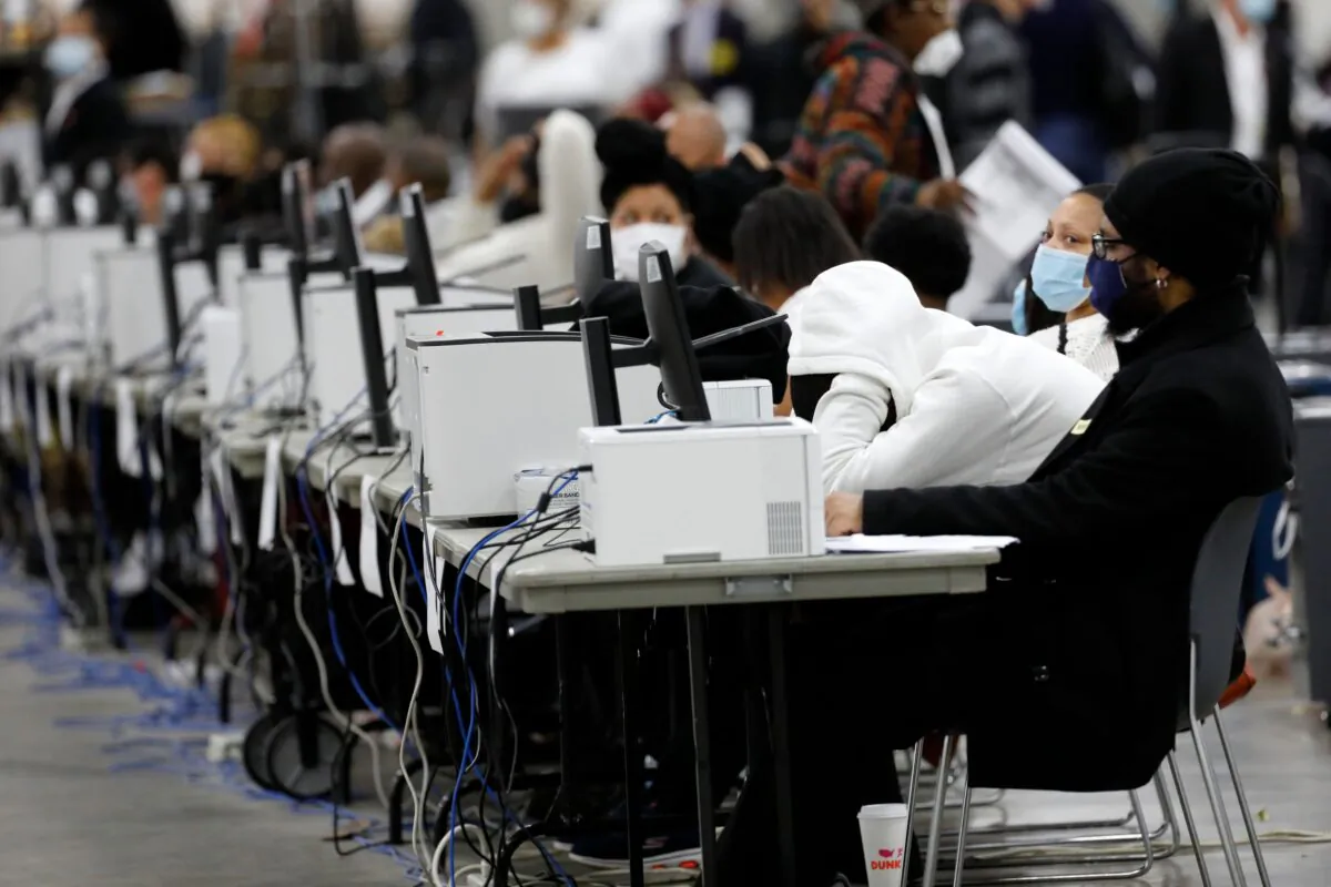 Detroit election workers work on counting absentee ballots for the 2020 general election at TCF Center in Detroit, Mich., on Nov. 4, 2020. (Jeff Kowalsky/AFP via Getty Images)