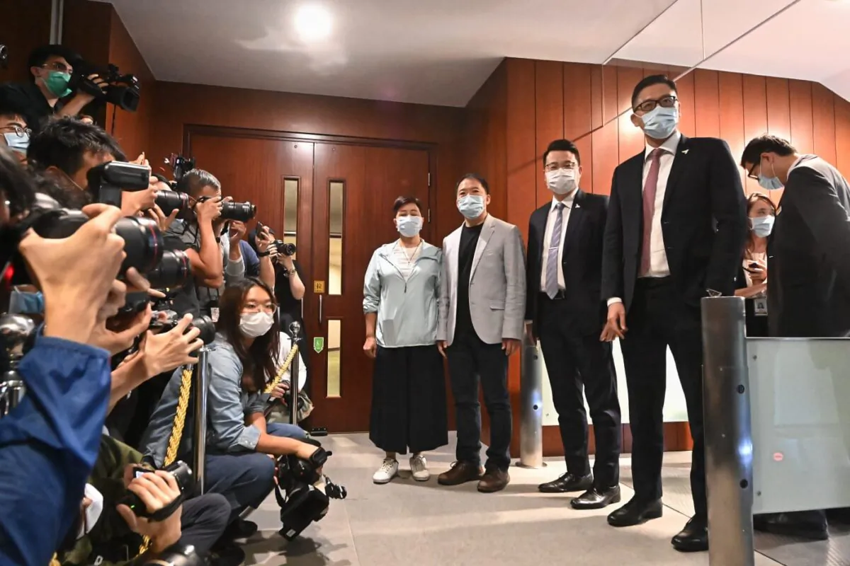 (L-R) Pro-democracy lawmakers Helena Wong, Wu Chi-wai, Andrew Wan, and Lam Cheuk-ting arrive at Hong Kong’s Legislative Council to submit their resignation letters on Nov. 12, 2020. (Song Bilung/The Epoch Times)
