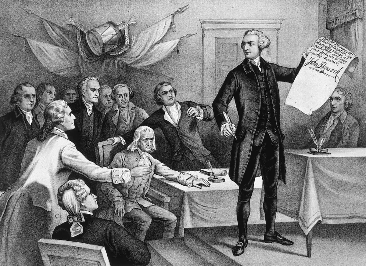 On July 4, 1776, John Hancock, president of the Continental Congress put his signature to the Declaration of Independence, watched by fellow patriots. Printed by Currier & Ives.  (MPI/Getty Images)