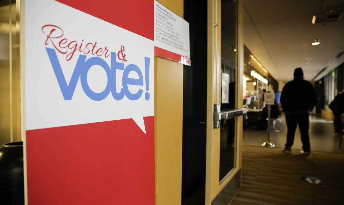 A sign for voter registration is pictured on Election Day at the King County Elections office in Renton, Wash., on Nov. 3, 2020. (Jason Redmond/AFP via Getty Images)
