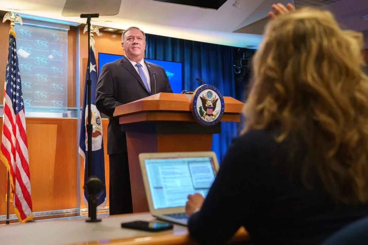 Secretary of State Mike Pompeo calls on a reporter while speaking about the counting of votes in the US election during a briefing, at the State Department in Washington, on Nov. 10. 2020. (Jacquelyn Martin / Pool / AFP via Getty Images)