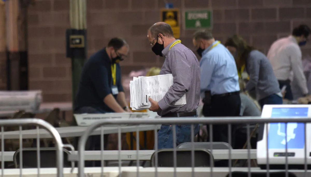 Allegheny County election employees organize ballots at the elections warehouse in Pittsburgh,  Pa., on Nov. 7, 2020. (Jeff Swensen/Getty Images)