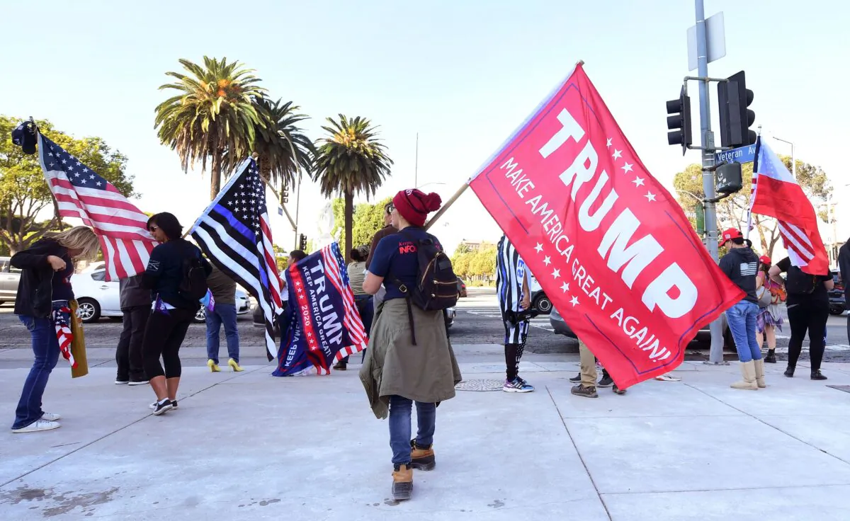Supporters of President Donald Trump hold a rally on Veteran's Day in Los Angeles, Calif., on Nov. 11, 2020. (Photo by Frederic J. Brown/AFP via Getty Images)