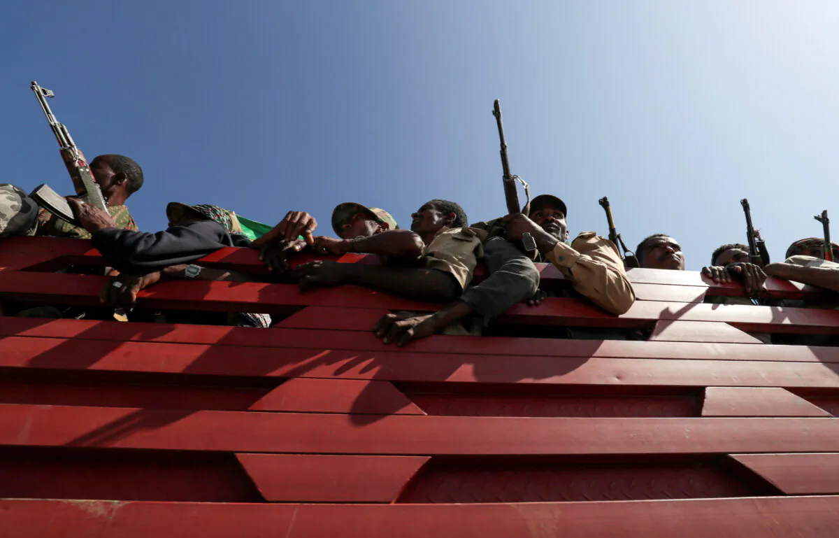 Members of Amhara region militias ride on their truck as they head to the mission to face the Tigray People's Liberation Front (TPLF), in Sanja, Amhara region near a border with Tigray, Ethiopia, on Nov. 9, 2020. (Tiksa Negeri/File Photo/Reuters)