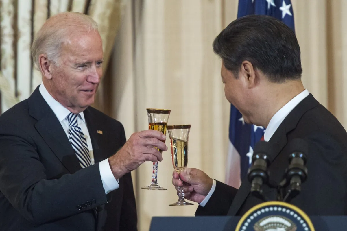 A photo of then U.S. Vice President Joe Biden and Chinese leader Xi Jinping making a toast during a state luncheon for China hosted by U.S. Secretary of State John Kerry at the Department of State in Washington, on Sept. 25, 2015. (Paul J. Richards/AFP via Getty Images)