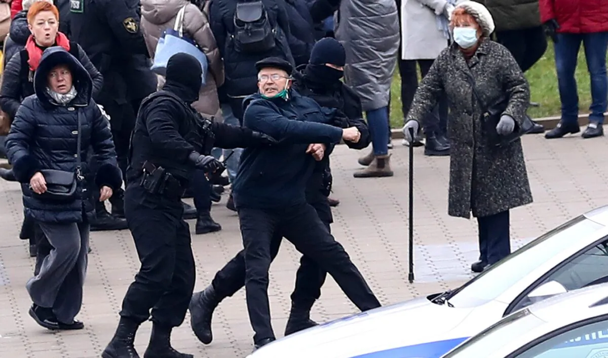 Belarusian riot police detain demonstrators during an opposition rally to protest the official presidential election results in Minsk, Belarus, on Nov. 15, 2020. (AP Photo)