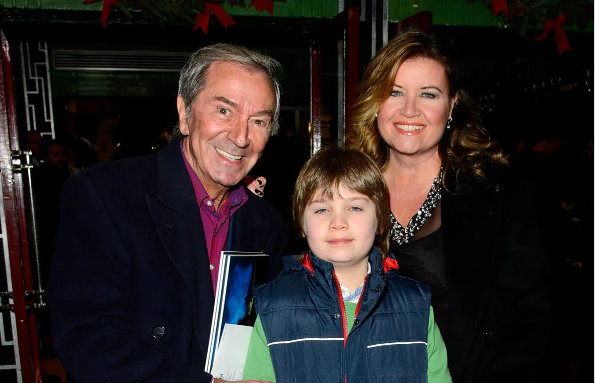 Des O'Connor, Jodie Brooke Wilson, and Adam O'Connor attend the press night for "Wicked" at Apollo Victoria Theatre in London, on Dec. 19, 2013. (Ben A. Pruchnie/Getty Images)