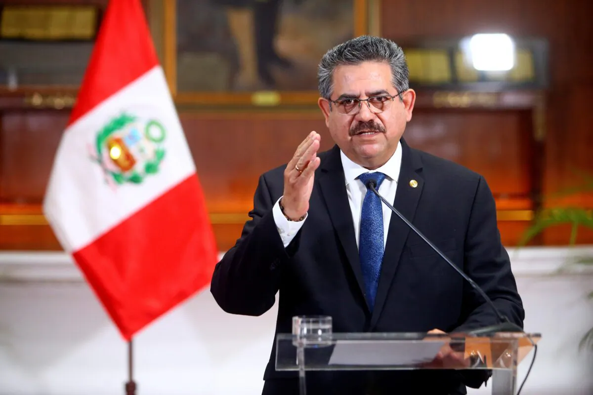 Peru's interim President Manuel Merino announces his resignation in a televised address, in Lima, Peru, on Nov. 15, 2020. (Peruvian Presidency/Handout via Reuters)