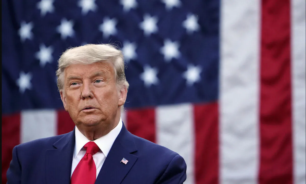 President Donald Trump raises his fist at the end of a rally to support Republican Senate candidates at Valdosta Regional Airport in Valdosta, Ga., on Dec. 5, 2020. (Andrew Caballero-Reynolds/AFP via Getty Images)