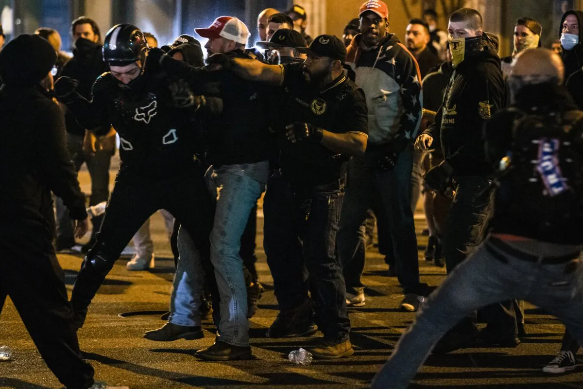 Members of Antifa and Proud Boys clash in the middle of the street following the "Million MAGA March" in Washington on Nov. 14, 2020. (Samuel Corum/Getty Images)