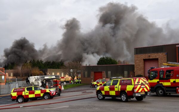 Fire fighters are seen attending a blaze involving a large quantity of tyres at a location near the railway's Bradford Interchange in Bradford on Nov.16, 2020. (West Yorkshire Fire & Rescue Service)