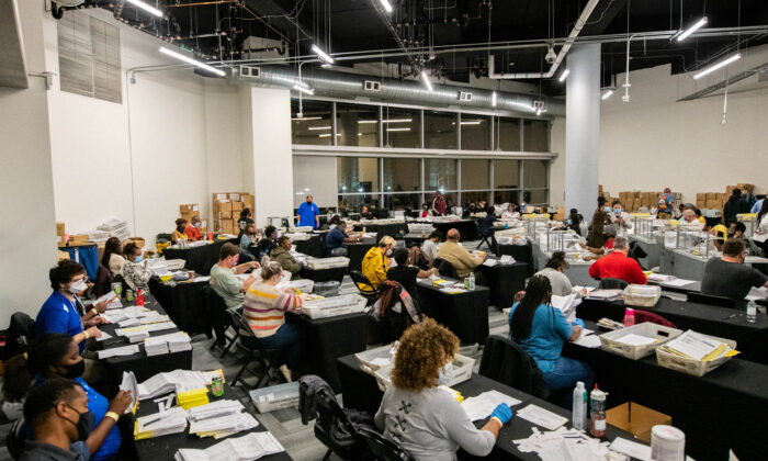 Employees of the Fulton County Board of Registration and Elections process ballots in Atlanta, Ga., on Nov. 4, 2020. (Brandon Bell/Reuters)