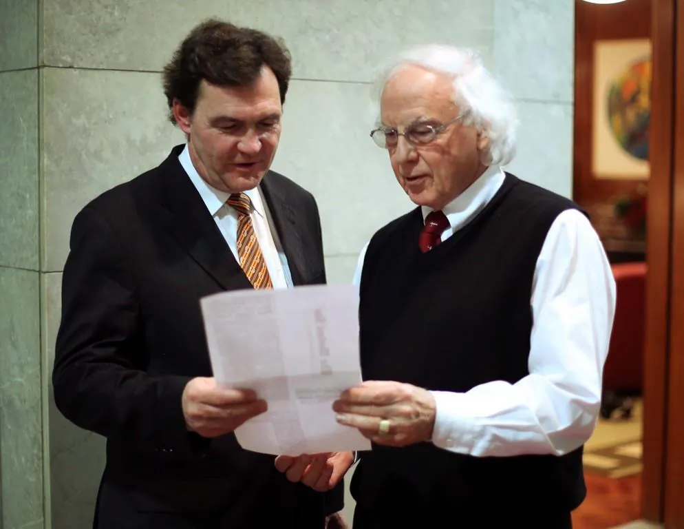 Former Federal Supreme Court Justice, Richard Wagner (L) confers with his colleague Supreme Court Justice Morris Fish in Ottawa, on December 10 2012. (The Canadian Press/Fred Chartrand)
