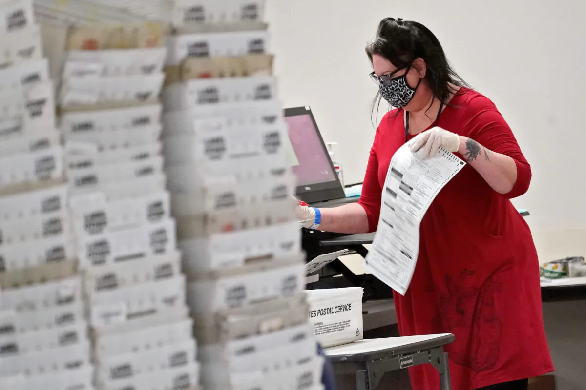 Arizona elections officials continue to count ballots inside the Maricopa County Recorder's Office in Phoenix, Arizona, on Nov. 6, 2020. (AP Photo/Matt York)