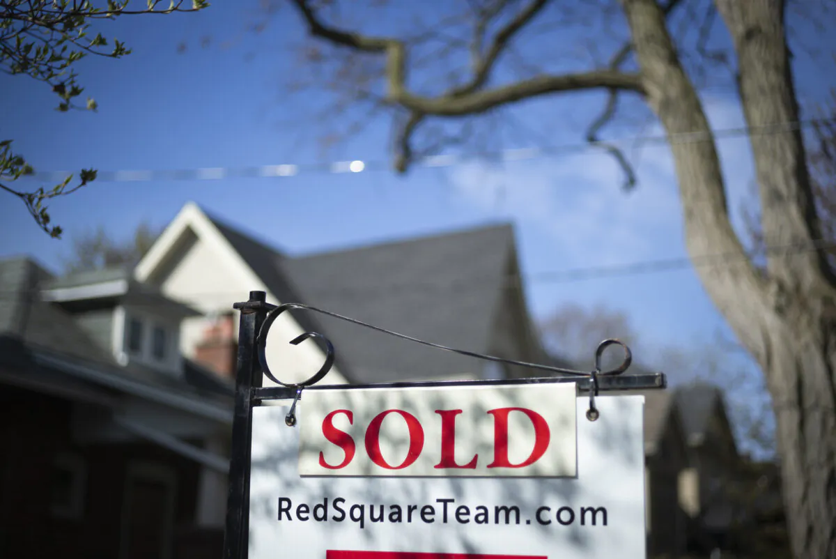 A real estate sold sign is shown in a Toronto west end neighbourhood, on May 17, 2020. (The Canadian Press/Graeme Roy)