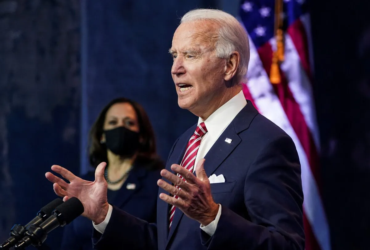 Democratic presidential nominee Joe Biden speaks about the U.S. economy as his running mate, Sen. Kamala Harris (D-Calif.), stands by following their briefing with economic advisers in Wilmington, Del., on Nov. 16, 2020. (Kevin Lamarque/Reuters)