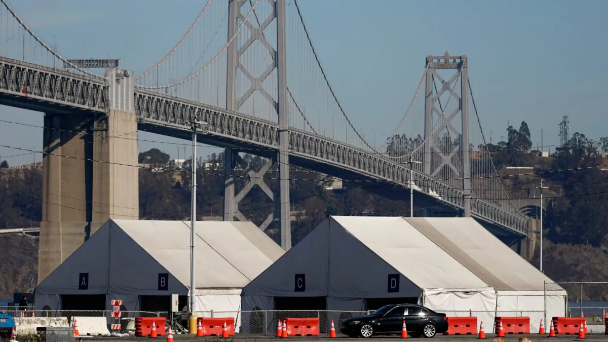 Tents from a COVID-19 testing site sit in front of the San Francisco-Oakland Bay Bridge in San Francisco, Calif., on Nov. 16, 2020. (Jeff Chiu/AP Photo)