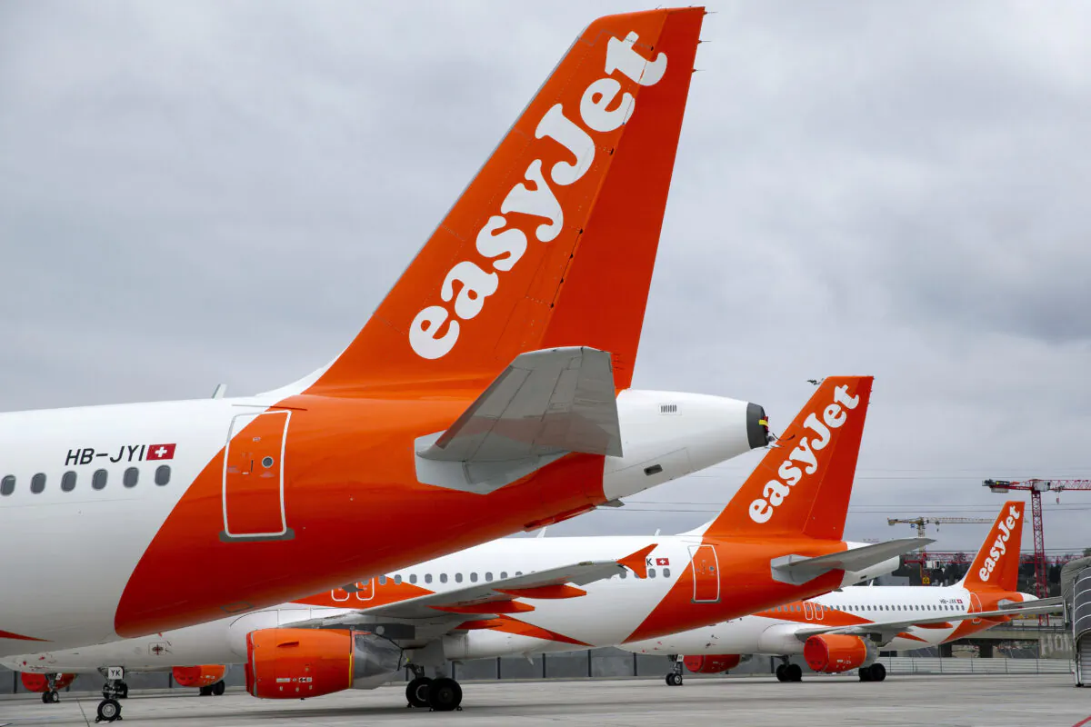 A large number of easyJet aircraft parked on the tarmac of the Geneve Aeroport, in Geneva, Switzerland, on March 30, 2020. (Salvatore Di Nolfi/Keystone via AP)