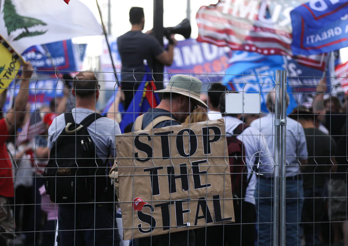 Supporters of President Donald Trump demonstrate at a ‘Stop the Steal’ rally in front of the Maricopa County Elections Department office in Phoenix, Ariz., on Nov. 7, 2020. (Mario Tama/Getty Images)