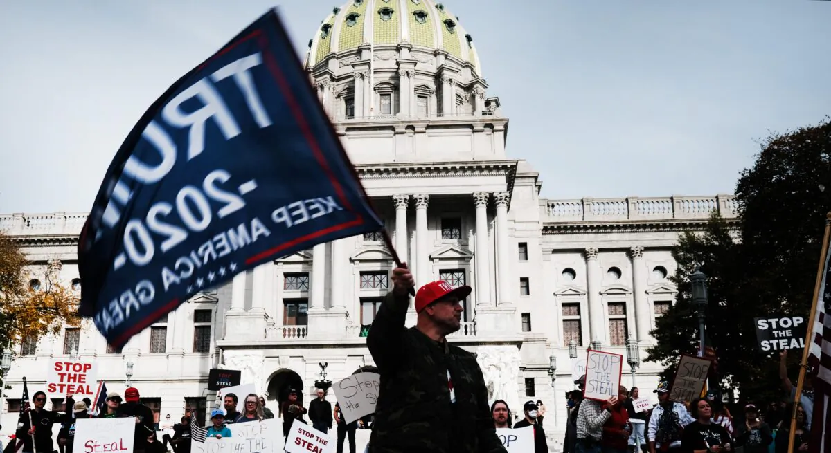 Dozens of people calling for stopping the vote count in Pennsylvania due to alleged fraud against President Donald Trump gather on the steps of the State Capital in Harrisburg, Penn., on Nov. 5, 2020. (Spencer Platt/Getty Images)