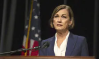 Iowa Governor Signs Law Letting Residents Buy, Carry Guns Without Permits