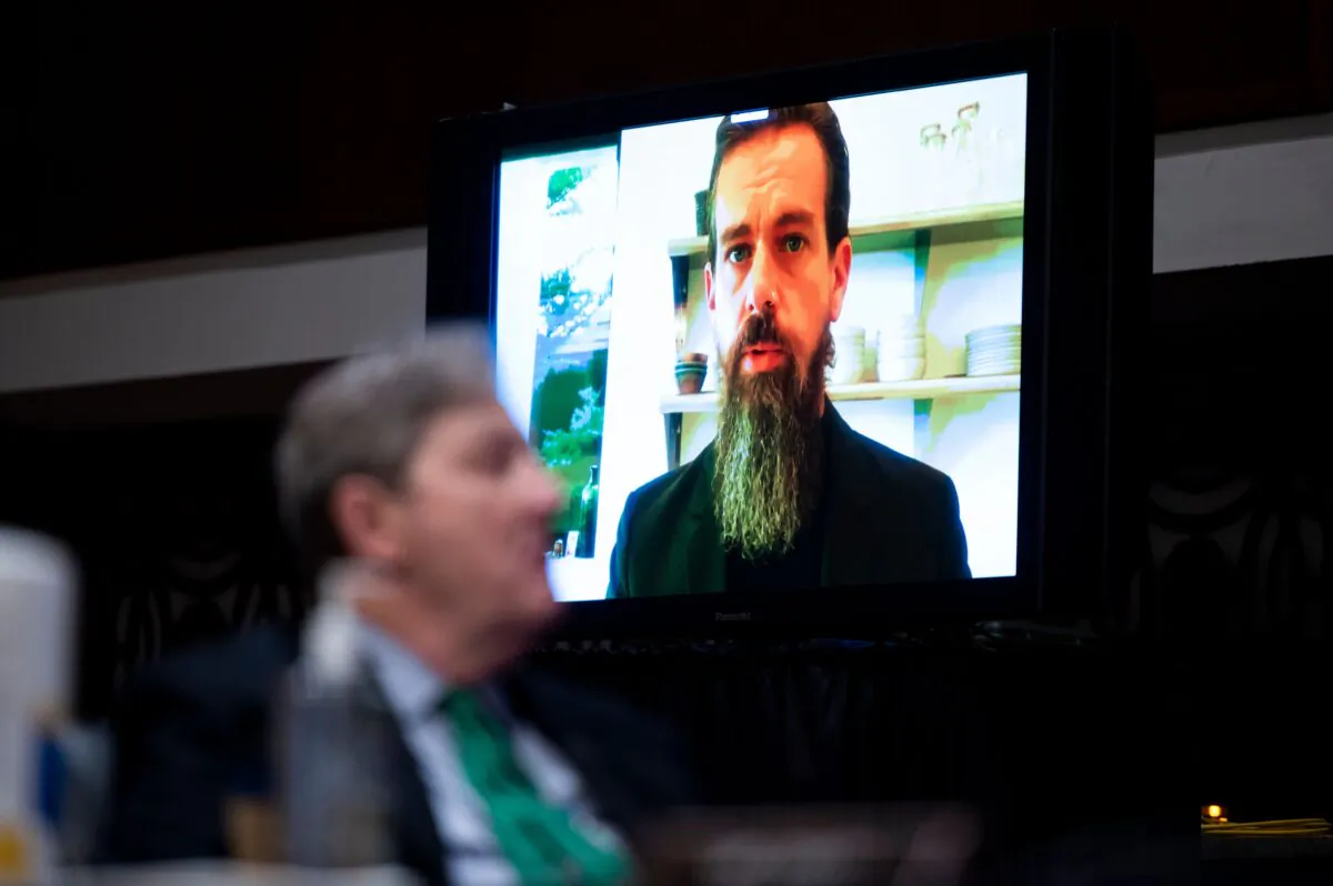 Jack Dorsey, chief executive officer of Twitter, testifies remotely as Sen. John Kennedy (R-La.) looks on during a Senate Judiciary Committee hearing on Capitol Hill in Washington on Nov. 17, 2020. (Bill Clark/POOL/AFP via Getty Images)