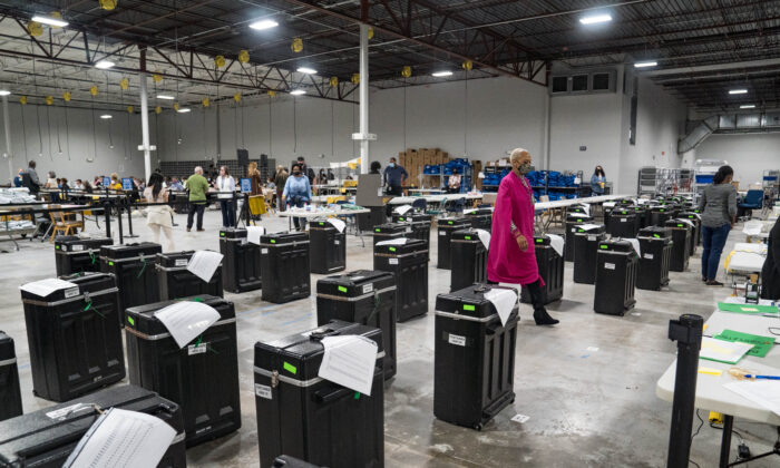 Gwinnett County election workers handle ballots as part of the recount for the 2020 presidential election at the Beauty P. Baldwin Voter Registrations and Elections Building in Lawrenceville, Ga., on Nov. 16, 2020. (Megan Varner/Getty Images)