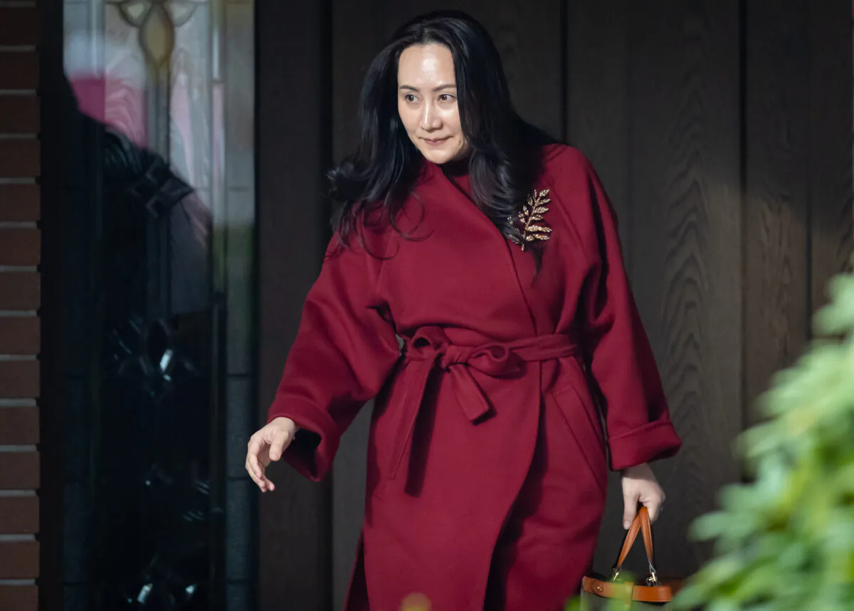Meng Wanzhou, chief financial officer of Huawei, leaves her home to attend a hearing at B.C. Supreme Court, in Vancouver, on Nov. 17, 2020. (Darryl Dyck/The Canadian Press)