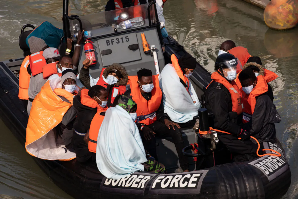 Border Force officials unload migrants that have been intercepted in the English Channel in Dover, England, on Sept. 22, 2020. (Luke Dray/Getty Images)