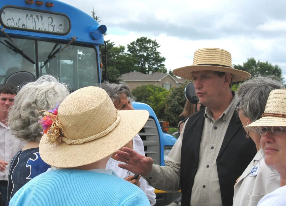 Dairy farmer and raw milk advocate Michael Schmidt talks to supporters outside court in Newmarket, Ont., on July 31, 2008. Schmidt has been fighting to make raw milk legal in Ontario for about two decades. (The Canadian Press/Colin Perkel)