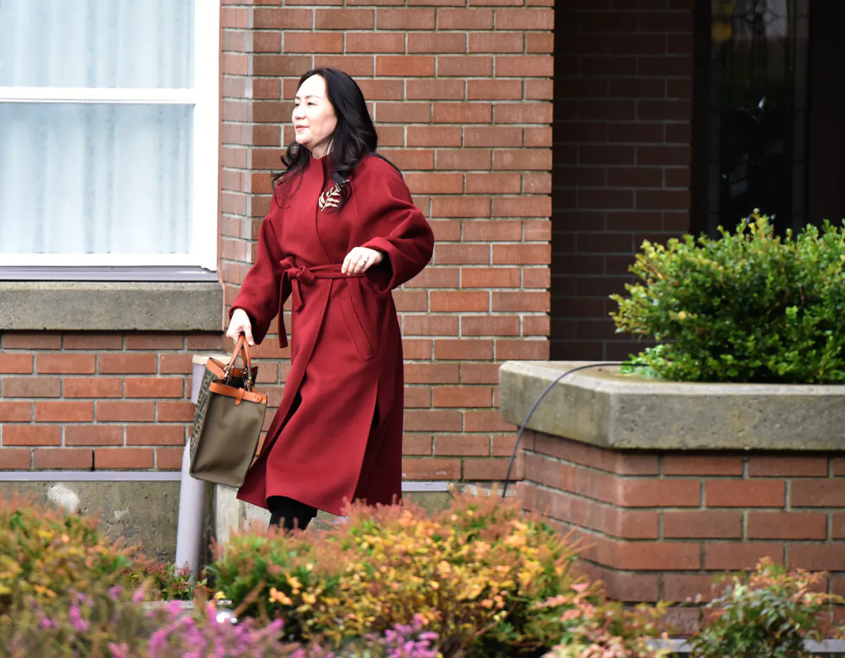 Huawei Chief Financial Officer, Meng Wanzhou, leaves her Vancouver home to appear in British Columbia Supreme Court, in Vancouver, Canada on November 17, 2020. (Don Mackinnon/AFP via Getty Images)