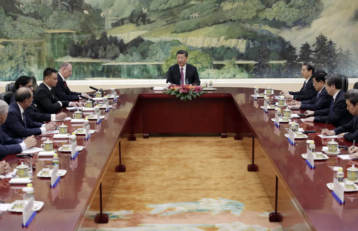 Chinese leader Xi Jinping (C) speaks during a meeting with delegates of the Shanghai Cooperation Organization (SCO) security secretary summit at the Great Hall of the People in Beijing, China, on May 22, 2018. (Jason Lee-Pool/Getty Images)