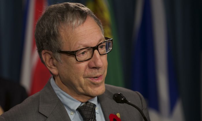 Irwin Cotler, former minister of justice and former attorney general of Canada, speaks during a press conference on Parliament Hill in a file photo. Cotler has authored a new report for a coalition of independent international legal experts exploring ways to increase protection for journalists. (Matthew Little/The Epoch Times)