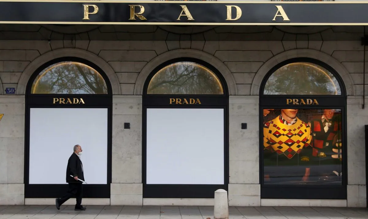 A man walks past a closed Prada shop after partial lockdown measures were introduced amid the coronavirus disease (COVID-19) outbreak in Geneva, Switzerland, on Nov. 16, 2020. (Denis Balibouse/Reuters)