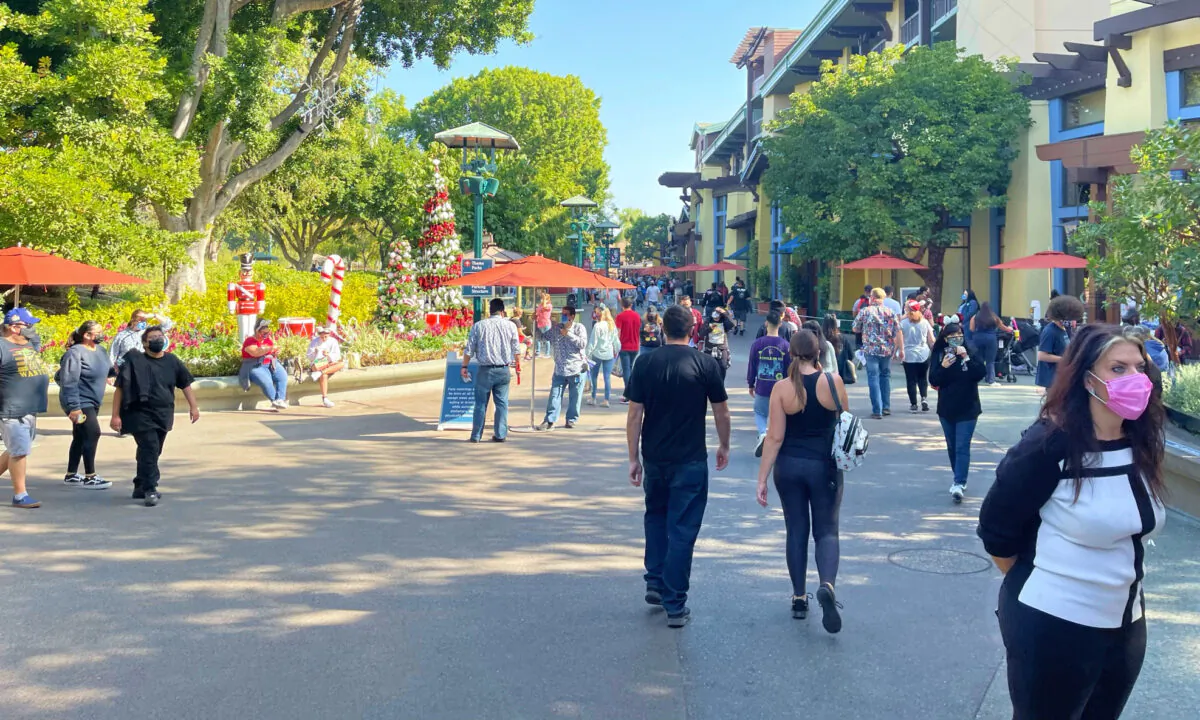 Guests enjoy the newly reopened Buena Vista Street, an extension of the Downtown Disney District, in Anaheim, Calif., on Nov. 19, 2020. (Drew Van Voorhis/The Epoch Times) 