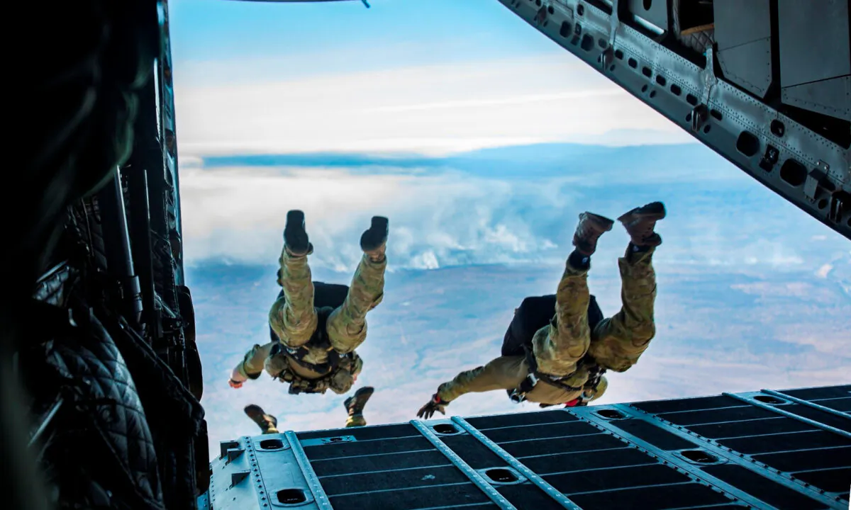 U.S. and Australian special operations forces (SOF) conduct a high-altitude low-opening (HALO) parachute jump from a Royal Australian Air Force (RAAF) C-27J Spartan of the 35 Squadron during Talisman Sabre in Queensland, Australia, July 17, 2019. Talisman Sabre is a bilateral exercise that tests the two forces combat training, readiness and interoperability. (U.S. Marine Corps photos by Lance Cpl. Nicole Rogge)