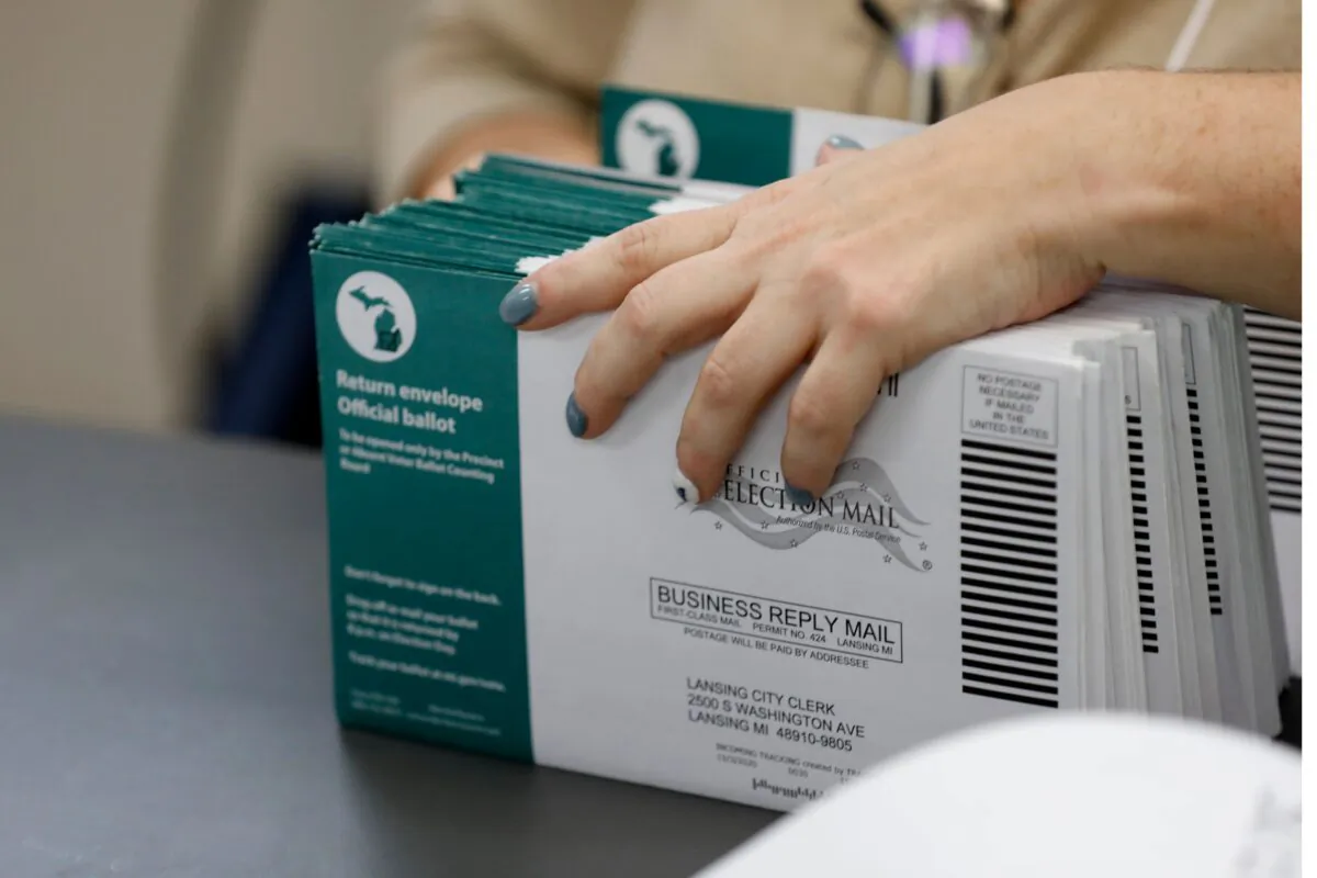 Workers start pre-processing absentee ballots at the city of Lansing Clerk's Election Unit in Lansing, Mich., on Nov. 2, 2020. (Jeff Kowalsky/AFP via Getty Images)
