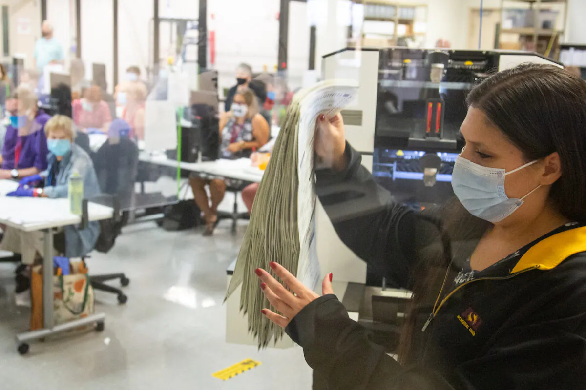 Votes are counted by staff at the Maricopa County Elections Department office in Phoenix, Ariz., on Nov. 5, 2020. (Courtney Pedroza/Getty Images)