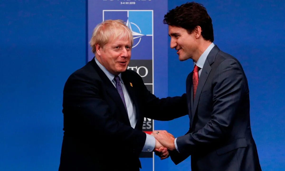 Britain's Prime Minister Boris Johnson (L) shakes hands with Canada's Prime Minister Justin Trudeau upon arrival for the NATO summit in Watford, northeast of London, on Dec. 4, 2019. (Adrian Dennis/AFP via Getty Images)
