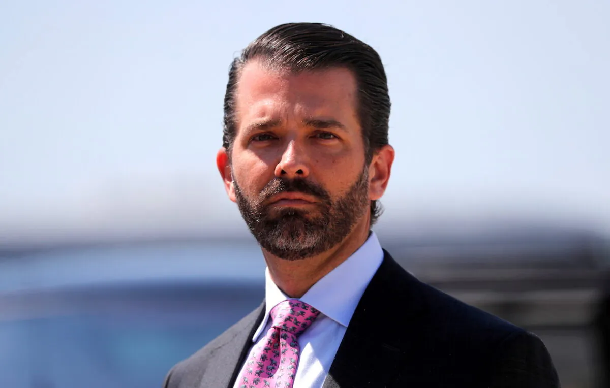 Donald Trump Jr. arrives with his father President Donald Trump after landing aboard Air Force One at General Mitchell International Airport in Milwaukee, Wis., on July 12, 2019. (Carlos Barria/Reuters)